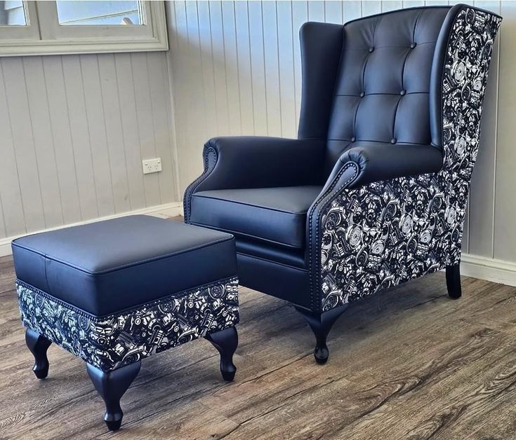 Black wingback chair with skull-print fabric panel and matching ottoman
