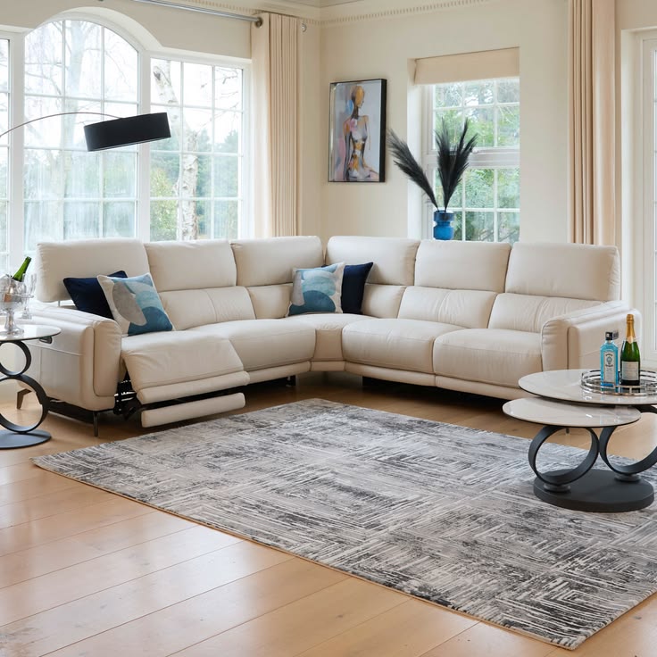 Teal leather sofa set with brass trim, three-piece